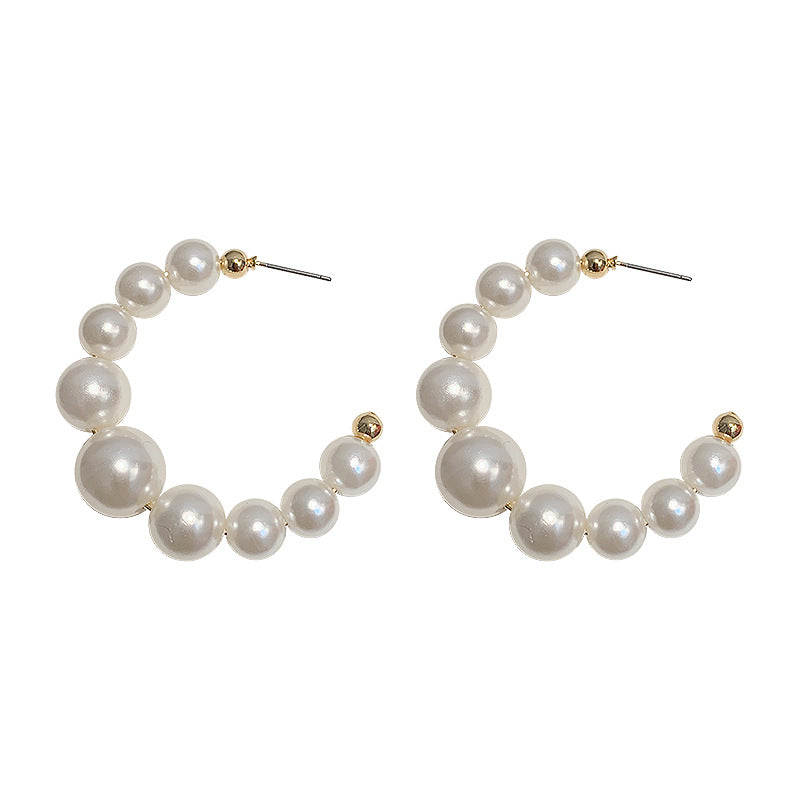 Pearl circle earrings on model – dainty hoop earrings women UK