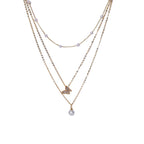 Butterfly pearl necklace close-up – feminine layered chain necklace UK