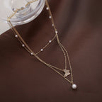 Delicate pearl butterfly necklace – layered chain pendant women UK