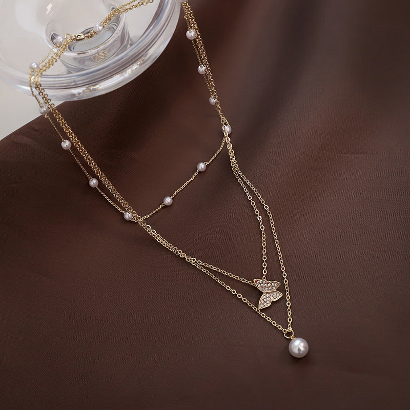 Delicate pearl butterfly necklace – layered chain pendant women UK