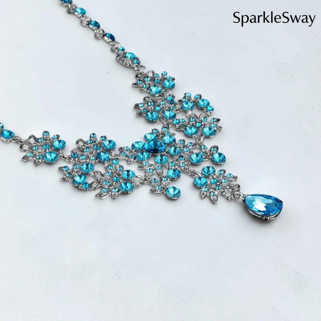 Blue gemstone necklace on a white background with 'SparkleSway' branding.
