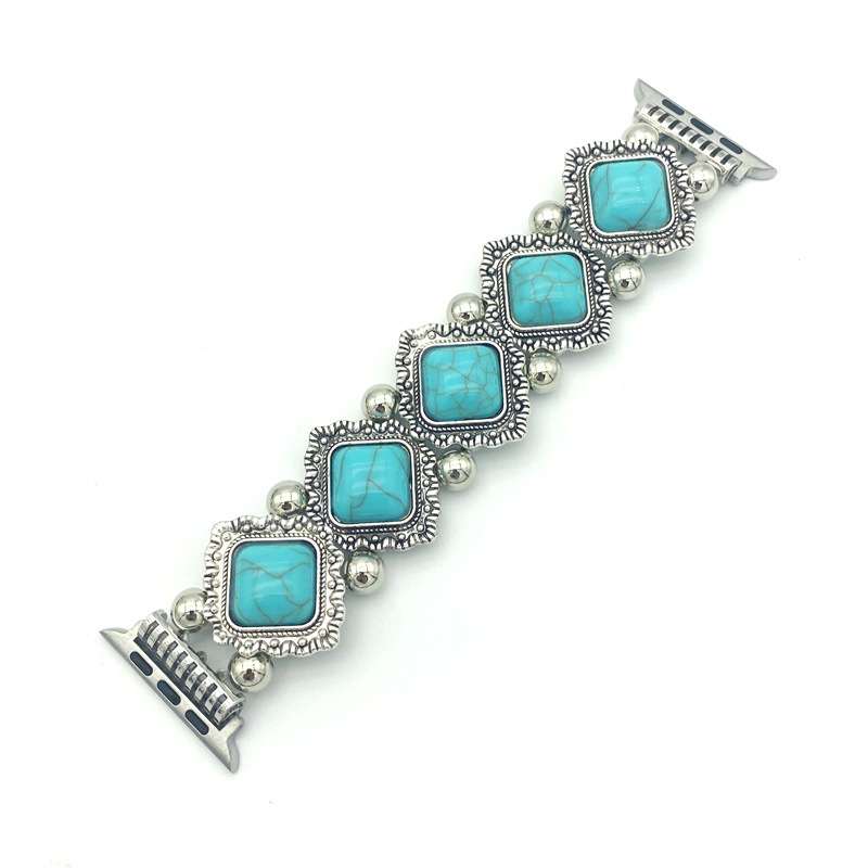 Bracelet with turquoise stones and silver accents on a white background