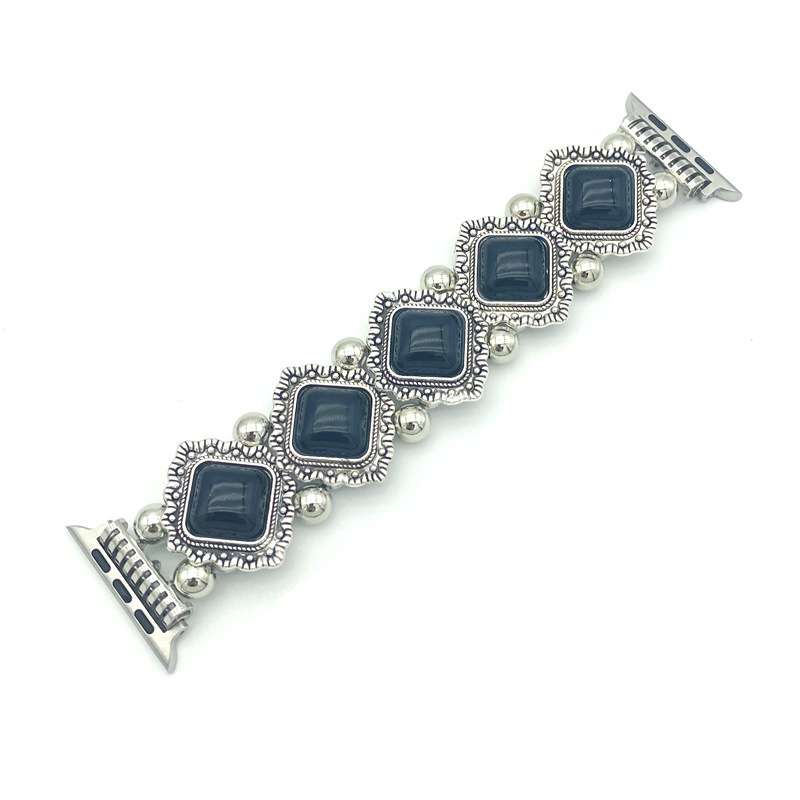 Silver bracelet with blue square stones on a white background