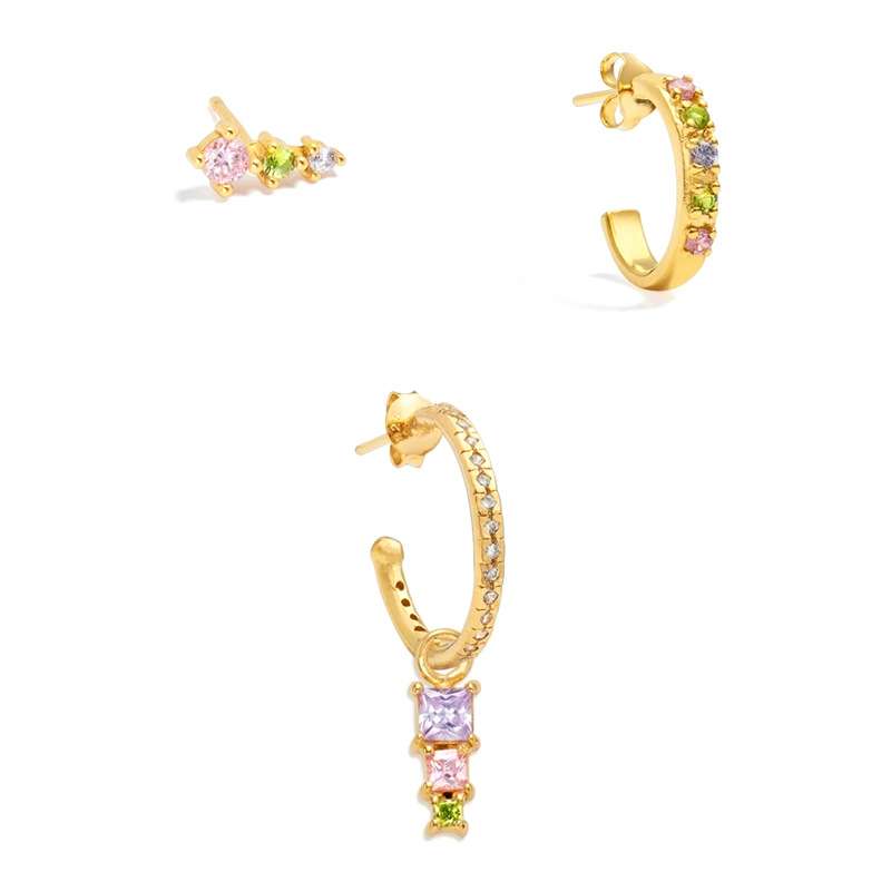 Gold hoop earrings with colorful gemstones on a white background