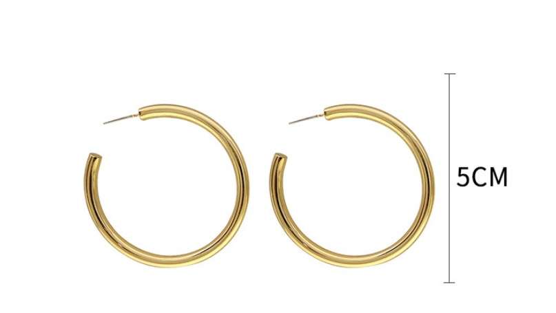 Gold hoop earrings with a measurement label on a white background