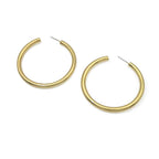 Gold hoop earrings on a white background