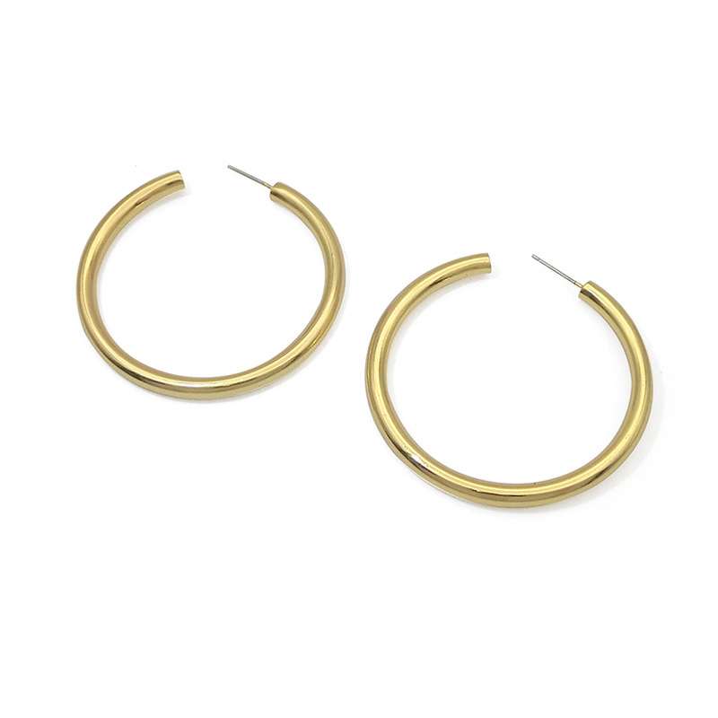 Gold hoop earrings on a white background