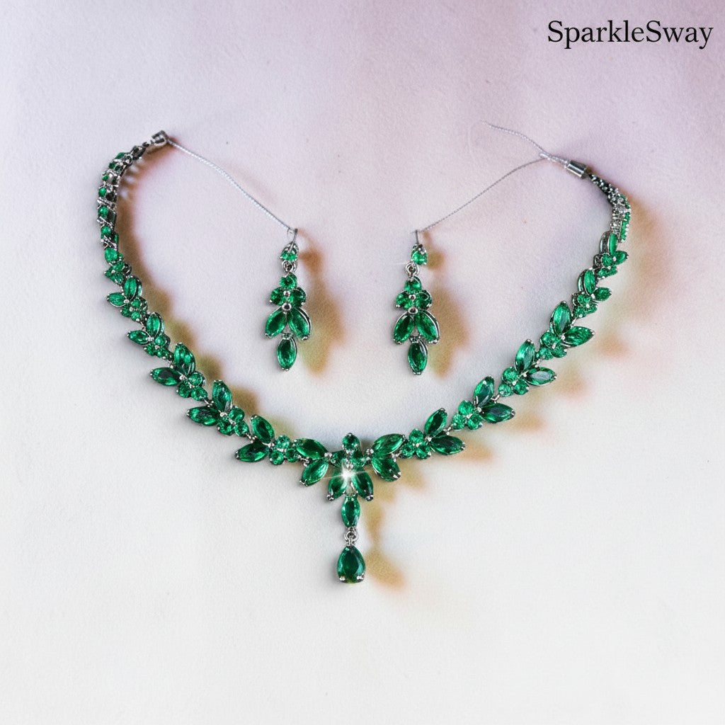 Green gemstone necklace and earrings set on a light background with 'SparkleSway' branding.