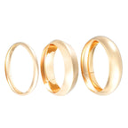 Three gold rings of different sizes on a white background