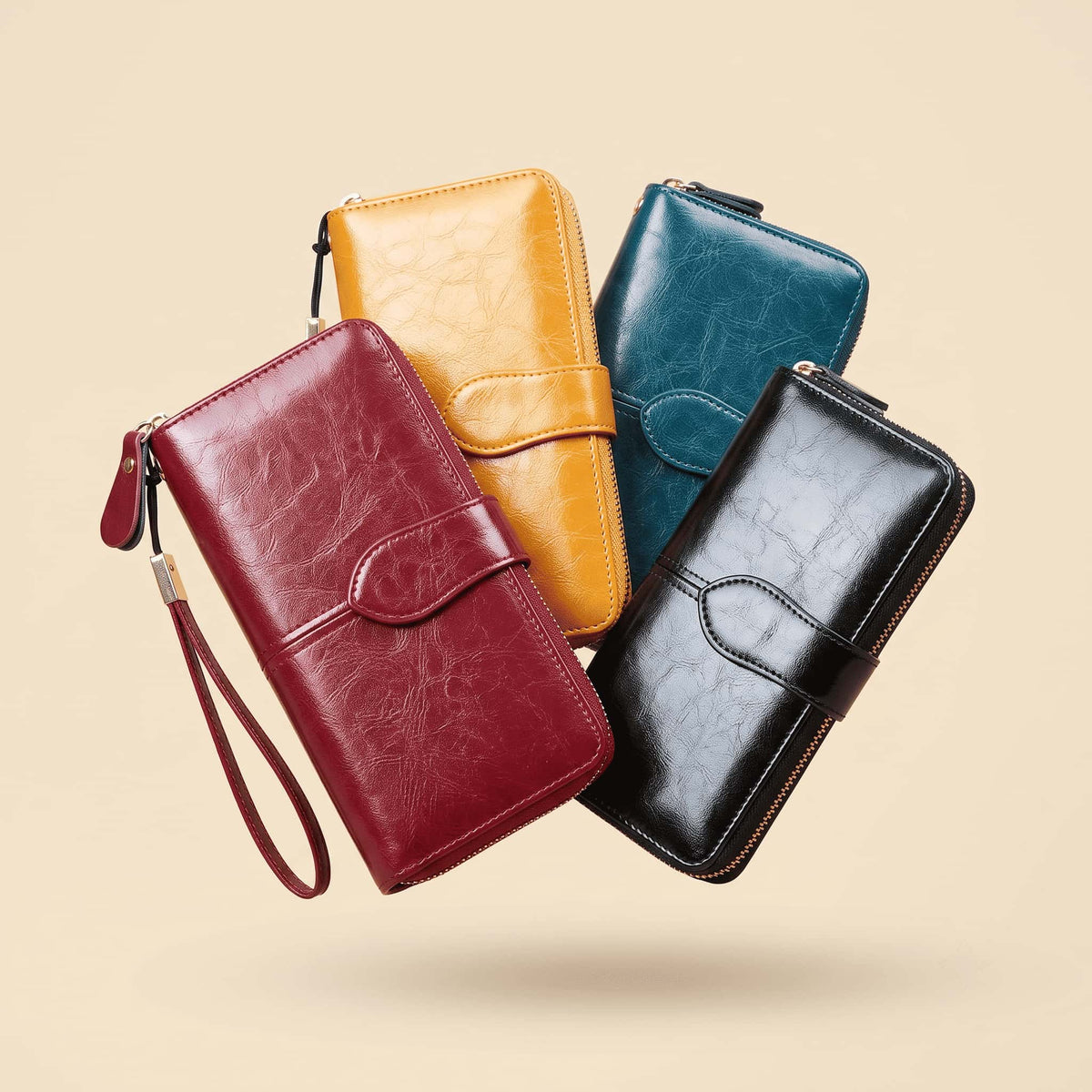Four long wallet-style phone cases floating against a warm beige background, shown in red, mustard yellow, teal blue, and black. Each case has a zip-around closure, a flap pocket, card slots, and a wrist strap on the red version.