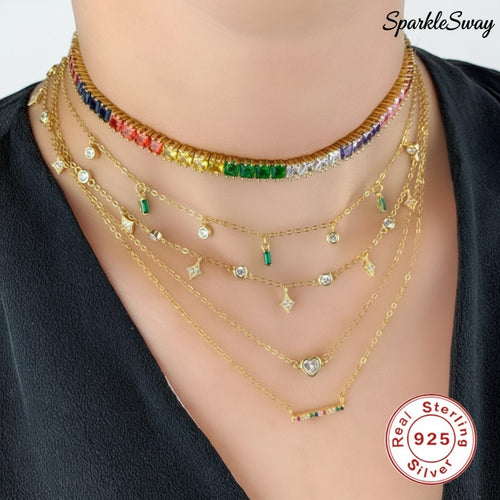 Multiple gold-tone necklaces with gemstones displayed on a mannequin, branded 'SparkleSway'.