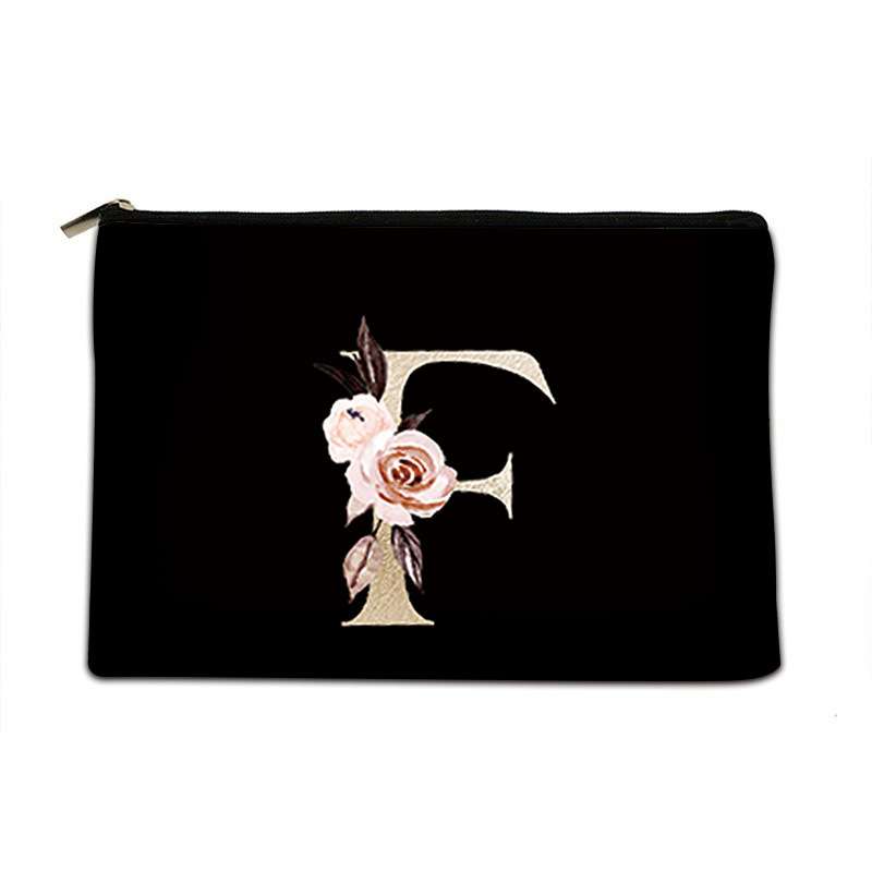 A black zippered pouch featuring a large decorative letter 'F' embellished with pink and white roses and green leaves, set against a plain white background.