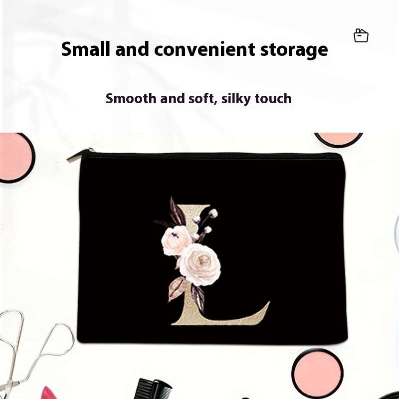 Black pouch with floral design and letter 'L' on a white background