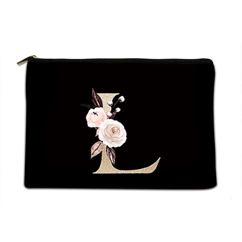 A black zippered pouch featuring a large decorative gold letter 'L' embellished with white and pink roses and green leaves, set against a plain white background.
