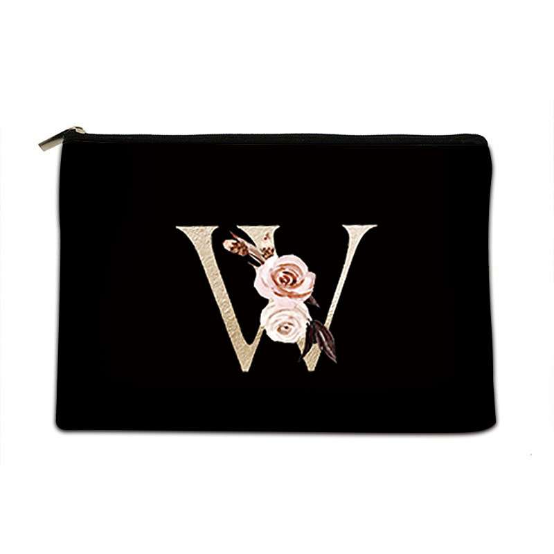 Black pouch with floral design and letter 'W' on a white background