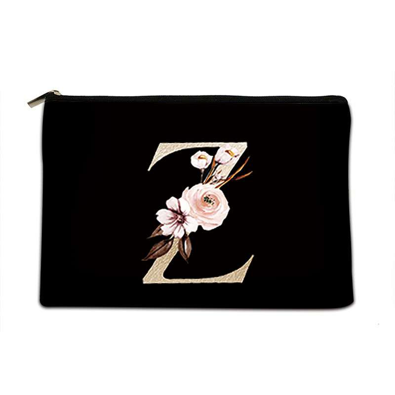 Black pouch with floral design and letter 'E' on a white background
