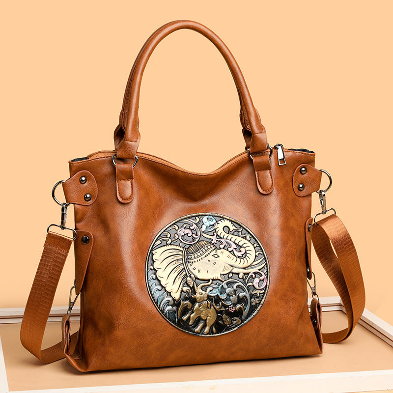 Retro Chinese Style Graceful And Fashionable Soft Bread leather handbag with intricate design.