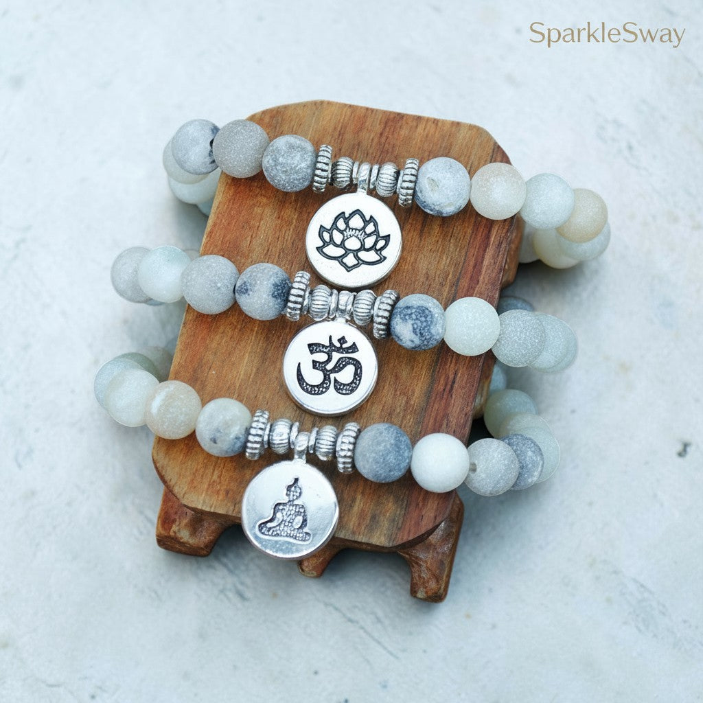 Set of beaded bracelets with symbolic charms on a wooden stand, branded 'SparkleSway'.