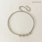 Silver star necklace on a light beige background with 'SparkleSway' branding.