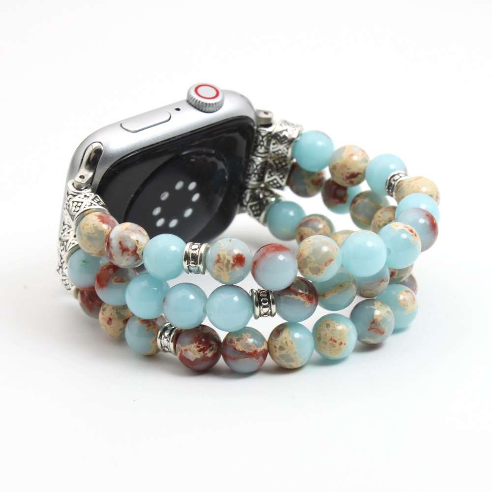 Beaded watch band with a silver watch on a white background