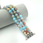 Beaded Apple Watch band with decorative end piece on a white background