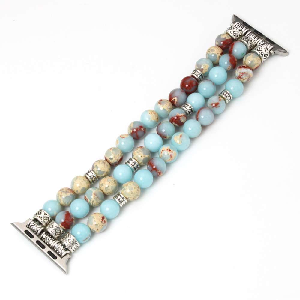 Beaded bracelet with decorative metal ends on a white background