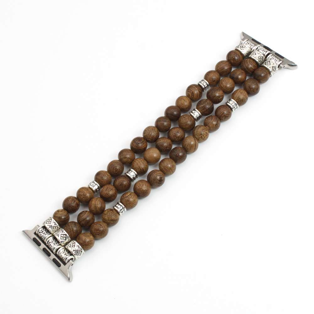 A beaded watch band featuring three strands of round brown wooden beads separated by small silver spacer rings, with ornate silver-toned metal clasp ends on a plain white background.