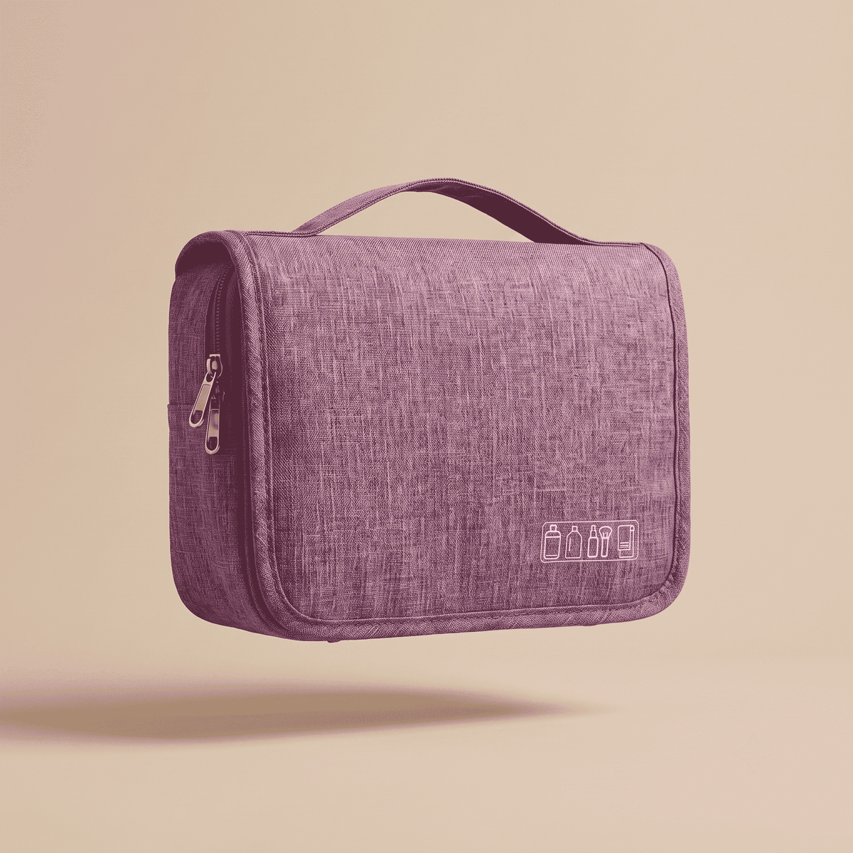 A purple textured fabric toiletry bag with a top handle, side zipper, and small white icon print on the front, shown floating against a solid beige background.