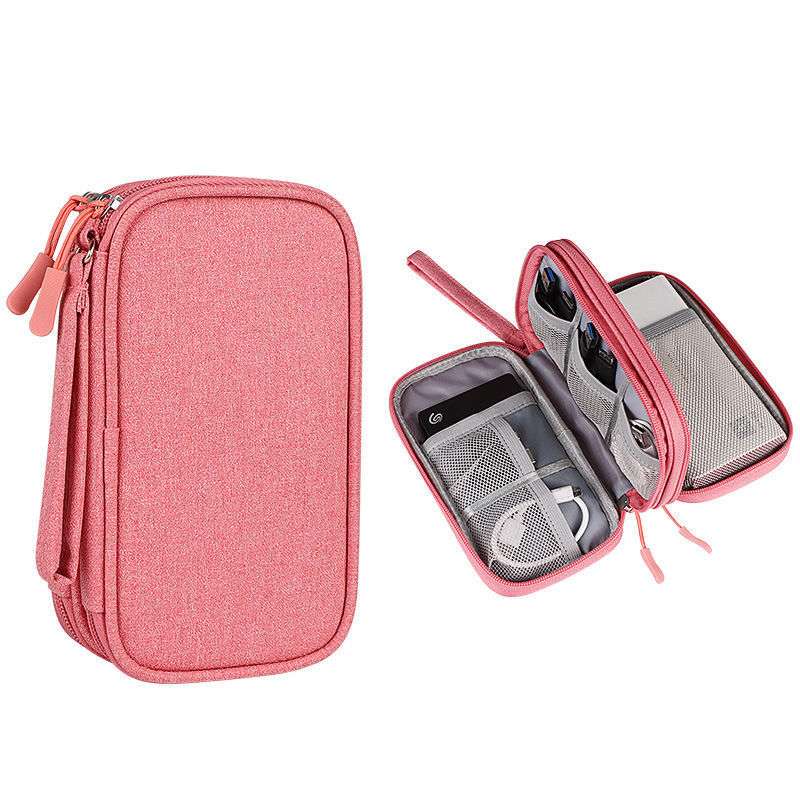Pink travel case with compartments on a white background