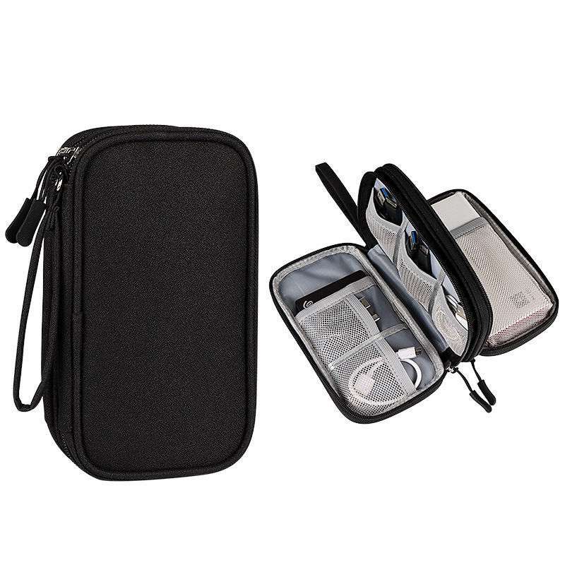 Black travel case with open view showing organized compartments on a white background
