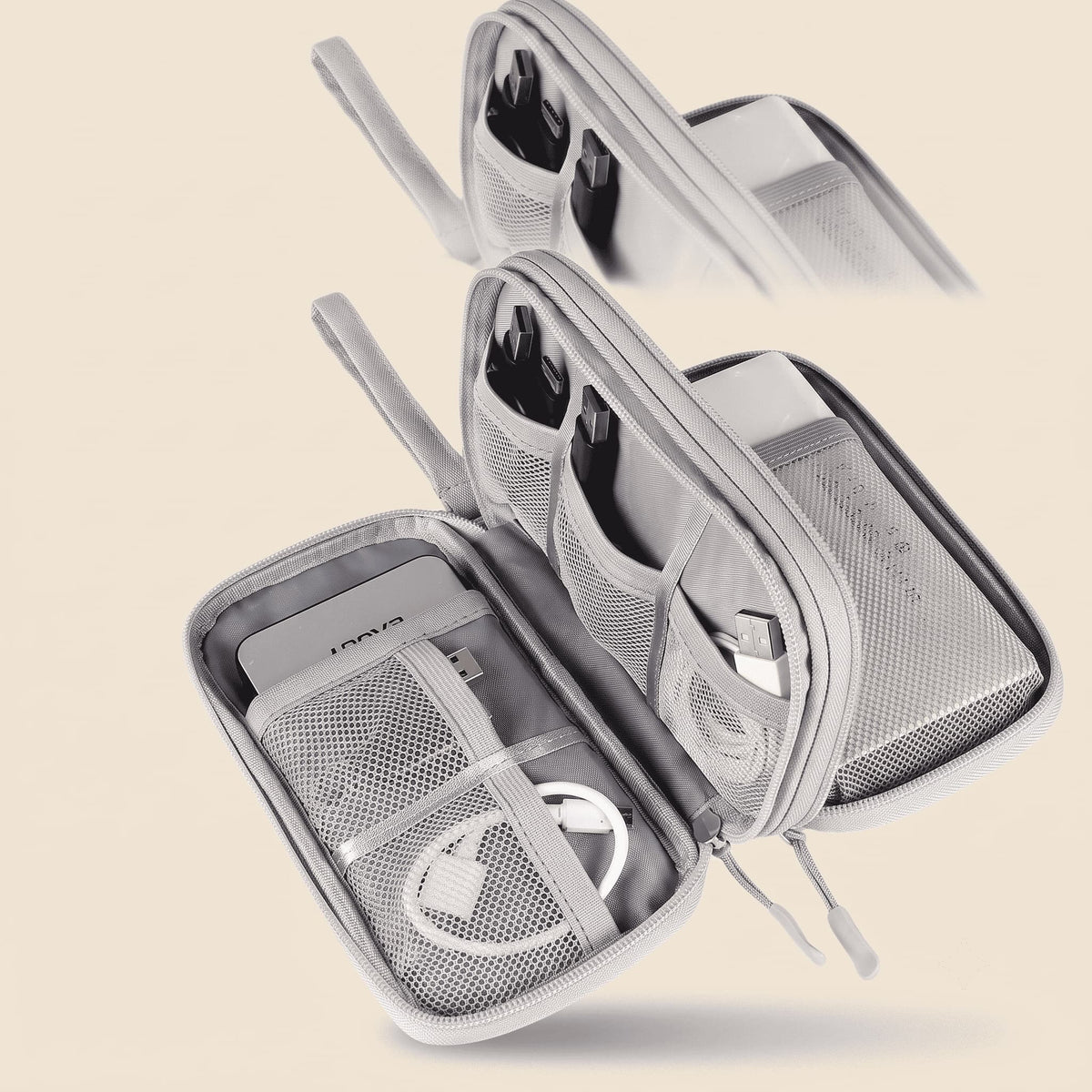 A light gray zippered travel organizer pouch shown open, with mesh pockets, elastic loops, and internal compartments holding charging cables and a small card. A smaller inset at the top shows the pouch closed, demonstrating the product from another angle.