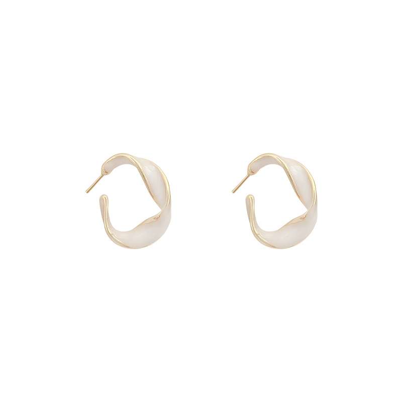 Pair of metallic car door handles on a white background
