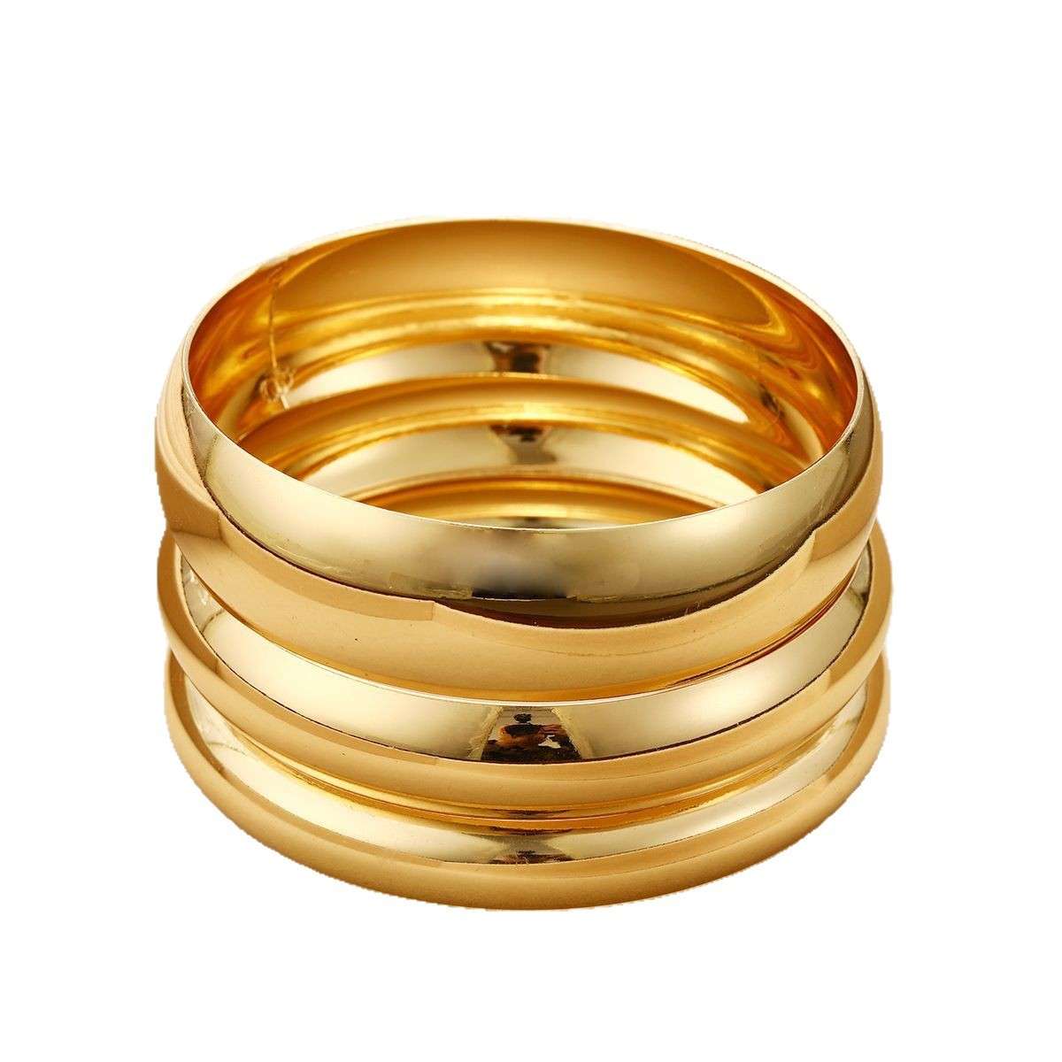 Stack of gold rings on a white background