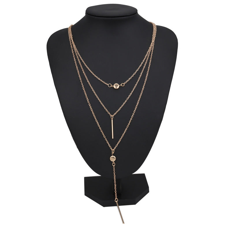 Dotted bar pendant necklace styled on model – dainty gold necklace UK