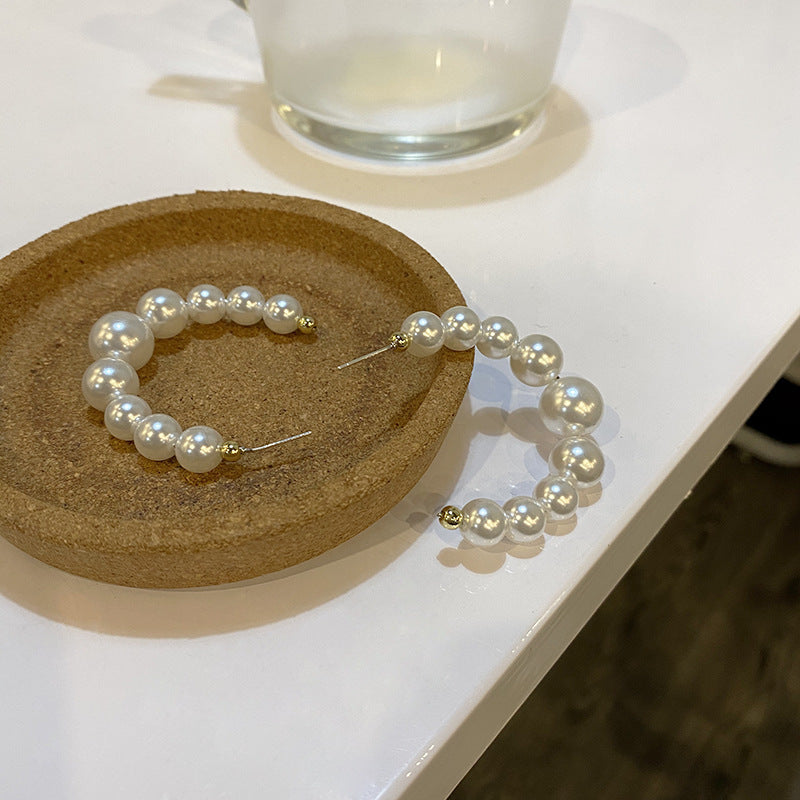 White pearl hoop earrings flat lay – elegant jewellery gift her UK