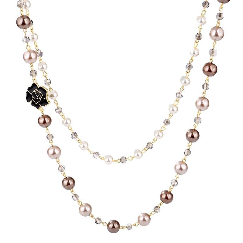 Long pearl pendant necklace close-up – elegant statement jewellery UK