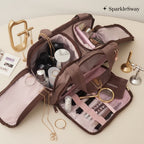 Sparklesway.co.uk brown and pink travel makeup bag with multiple compartments and brush holders, filled with cosmetics.