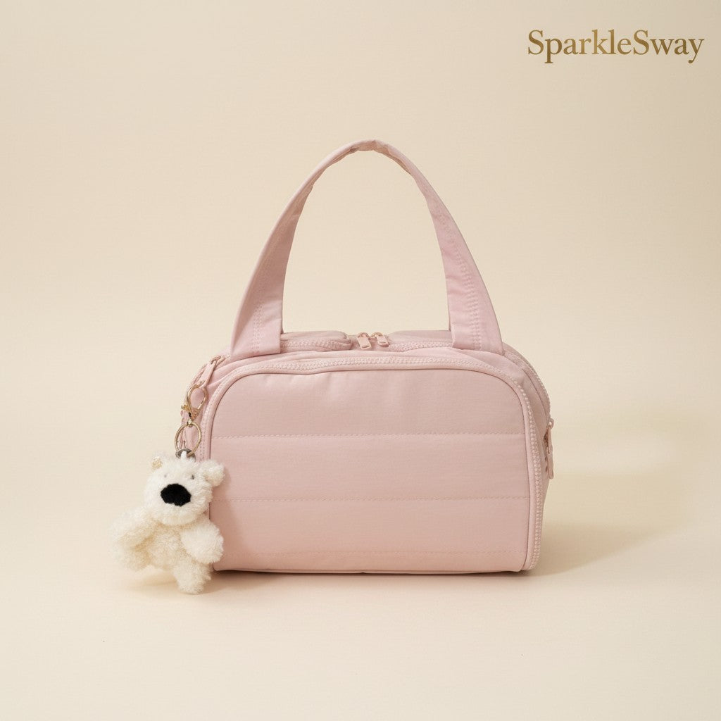Sparklesway.co.uk pink quilted nylon travel bag with multiple zippered pockets and a plush dog keychain.