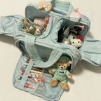 Sparklesway.co.uk light blue nylon travel bag with multiple compartments, filled with makeup, toiletries, and cute character accessories.