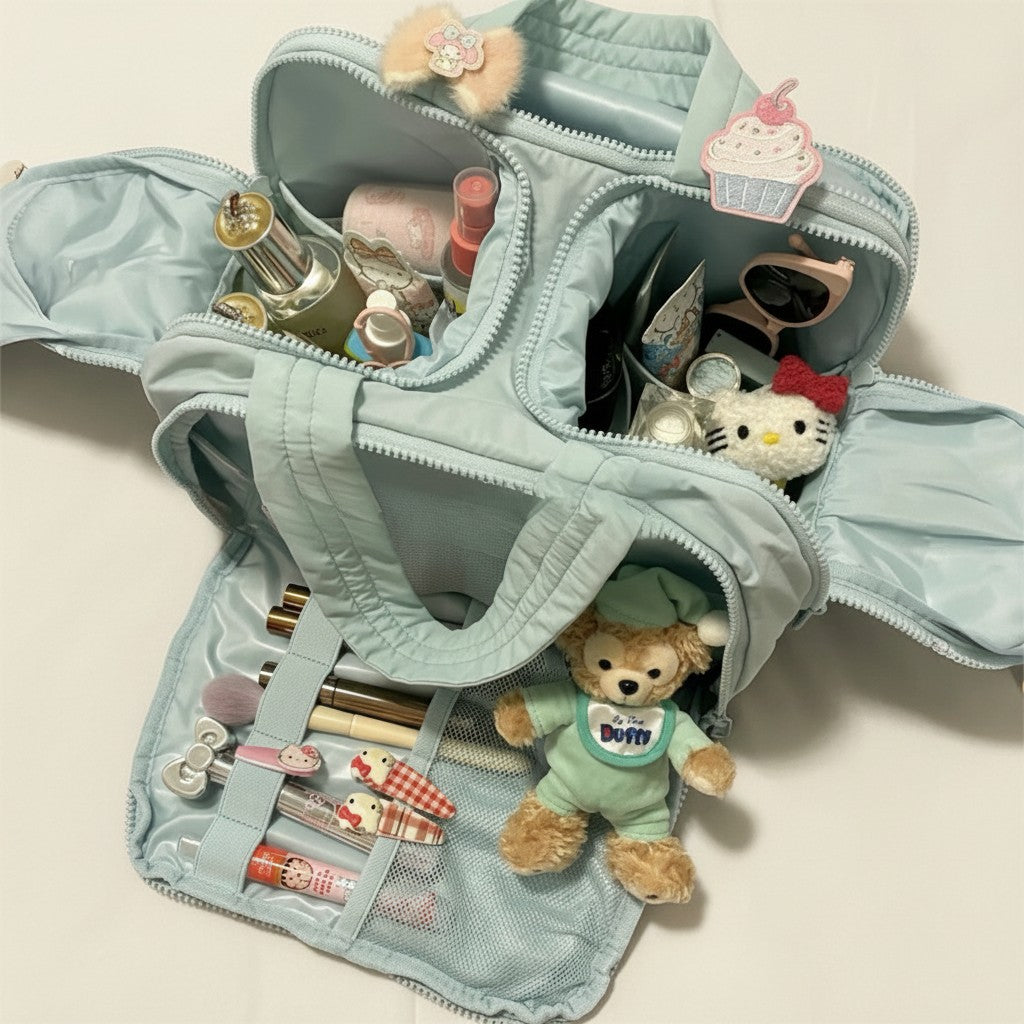 Sparklesway.co.uk light blue nylon travel bag with multiple compartments, filled with makeup, toiletries, and cute character accessories.